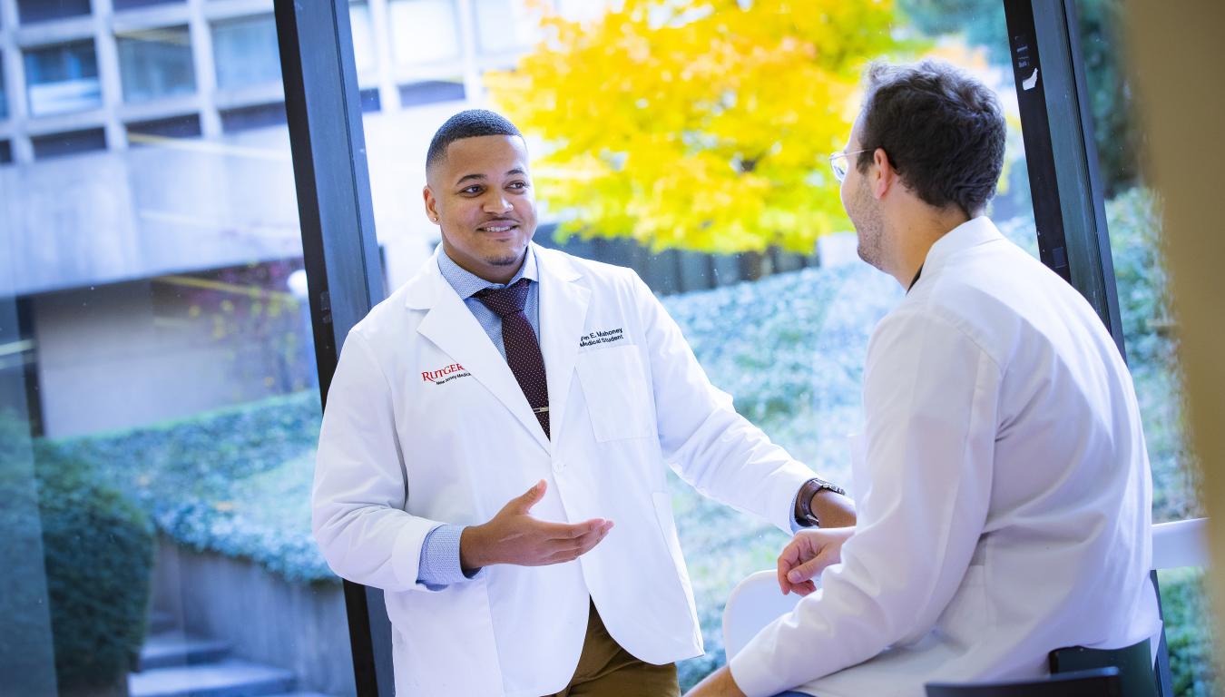 doctor speaking to student patient