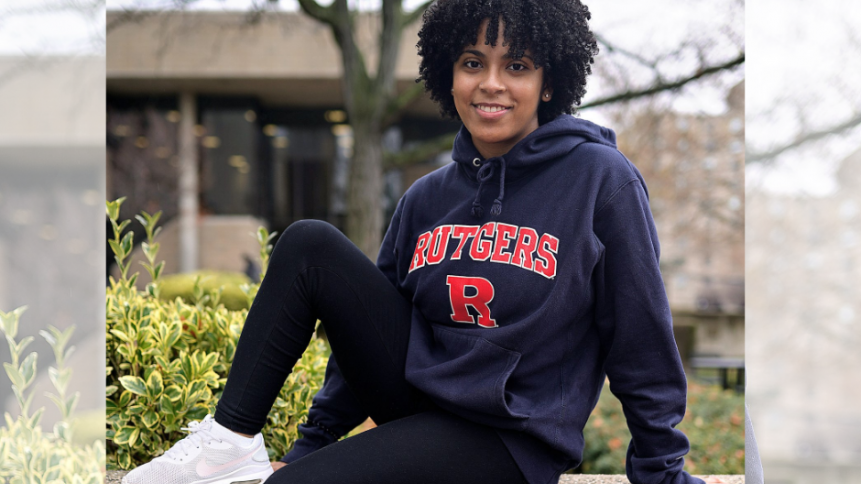 female student with black rutgers hoodie